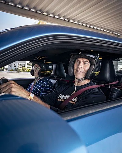 Couple smiling, about to start driving