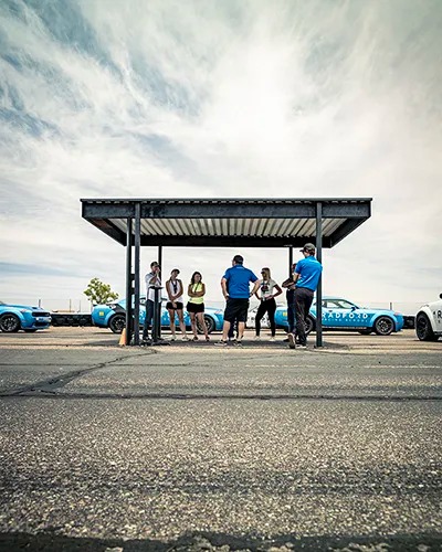 Instructors going over rules with drivers