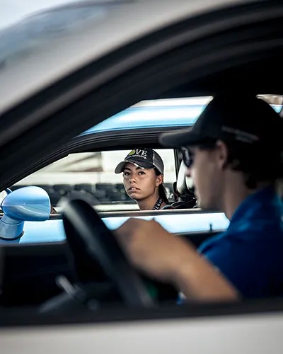 female driver looking off into distance